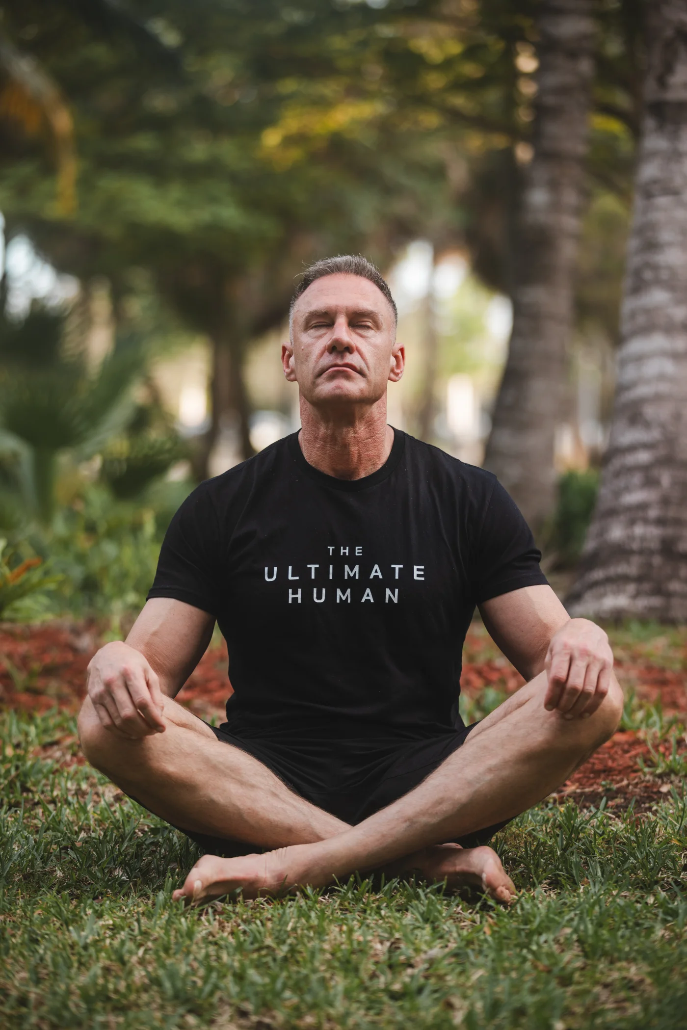 Gary Brecka practising breathwork outdoors.