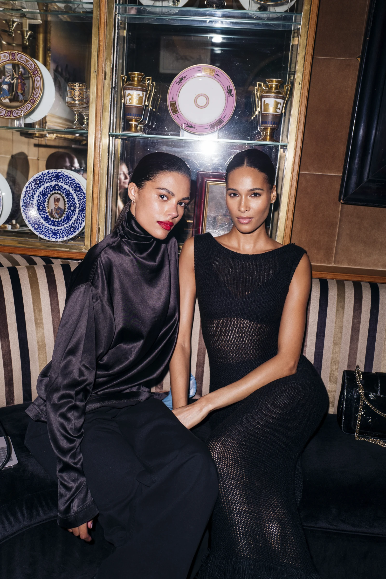 Two guests seated at PrettyLittleThing’s Caviar Kaspia relaunch, photographed by German Larkin.